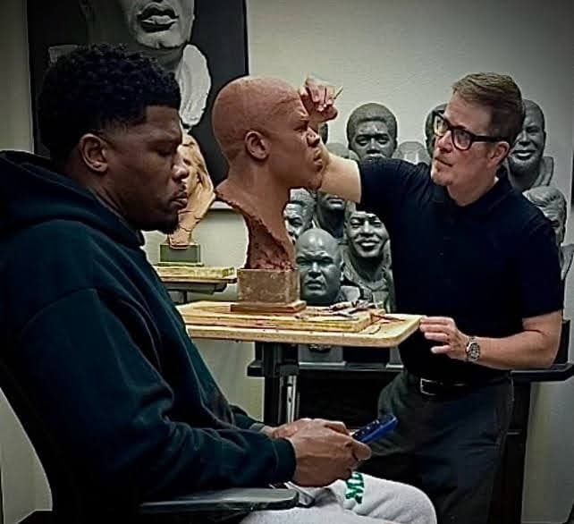 Scott Myers sculpting a portrait bust in the studio