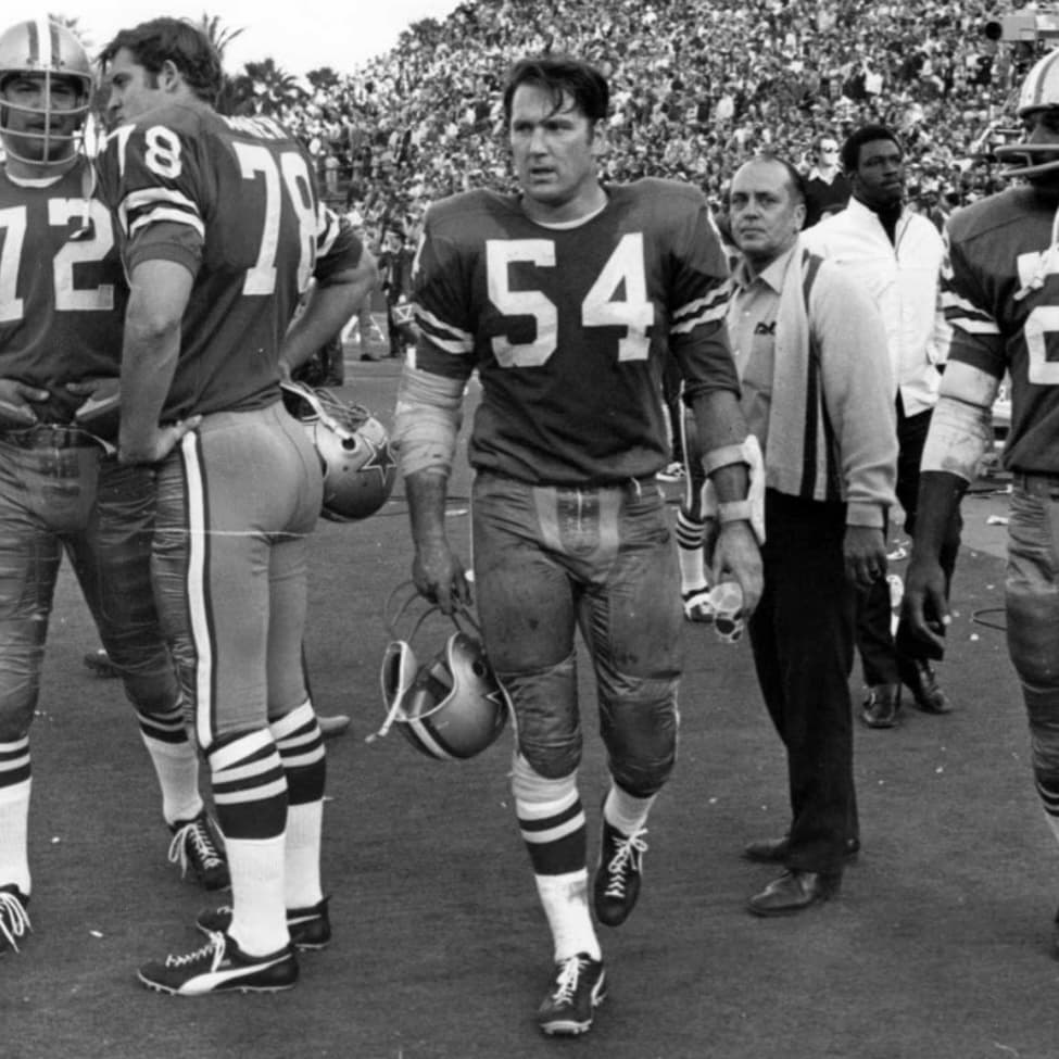 Chuck Howley walking off the football field in uniform
