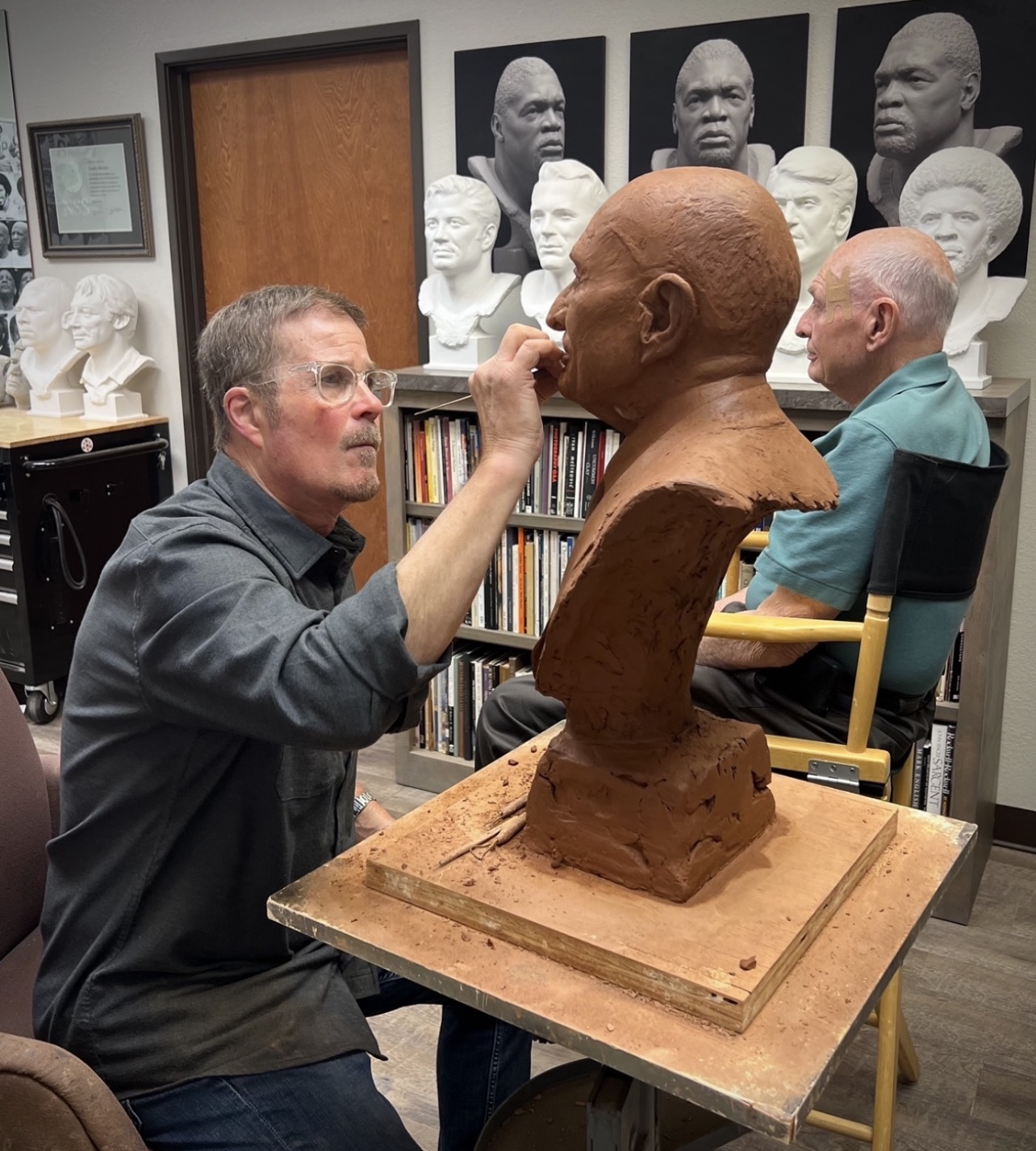Scott Myers sculpting a portrait bust in the studio