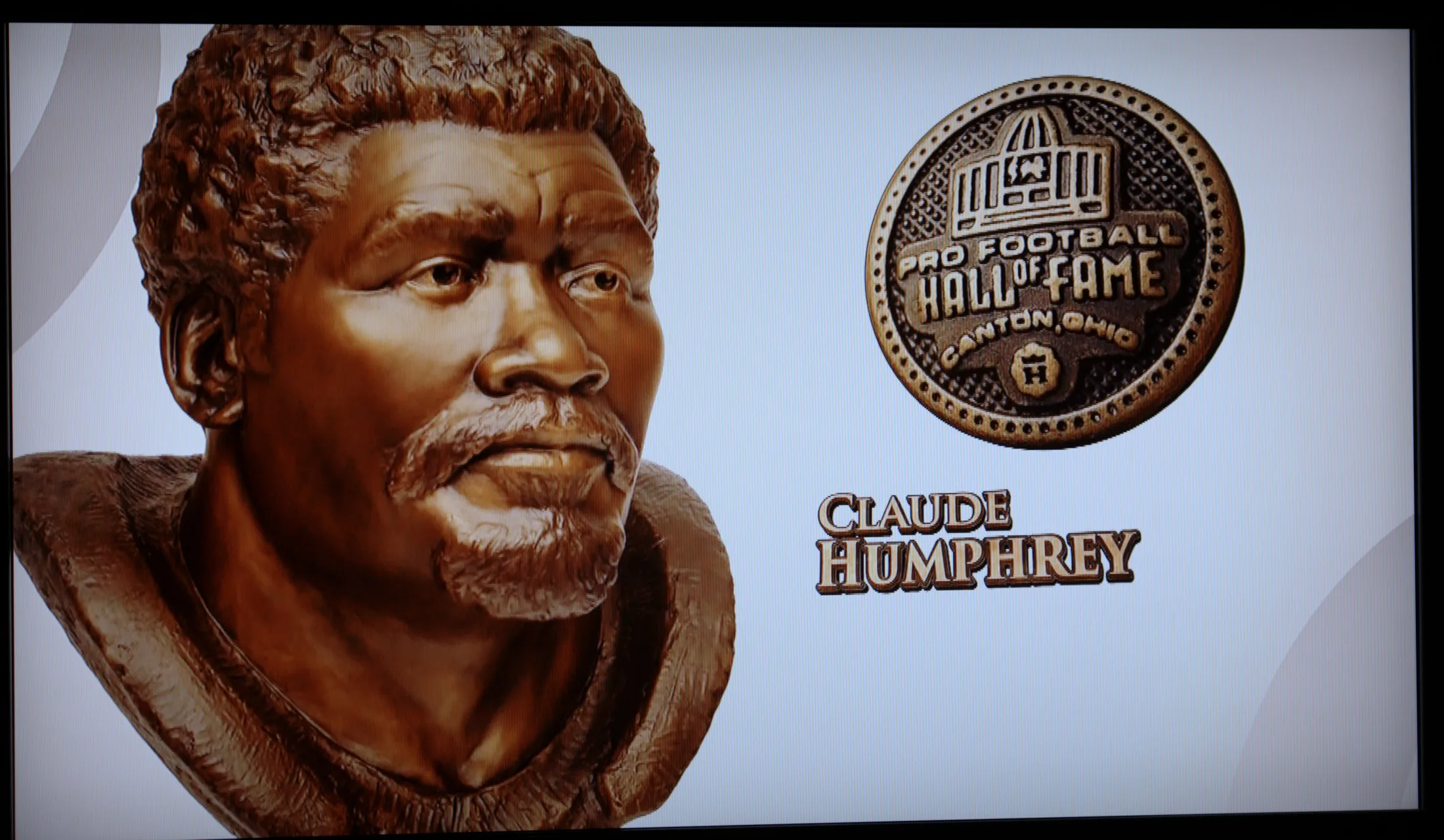 Claude Humphrey portrait bust and Pro Football Hall of Fame medallion graphic