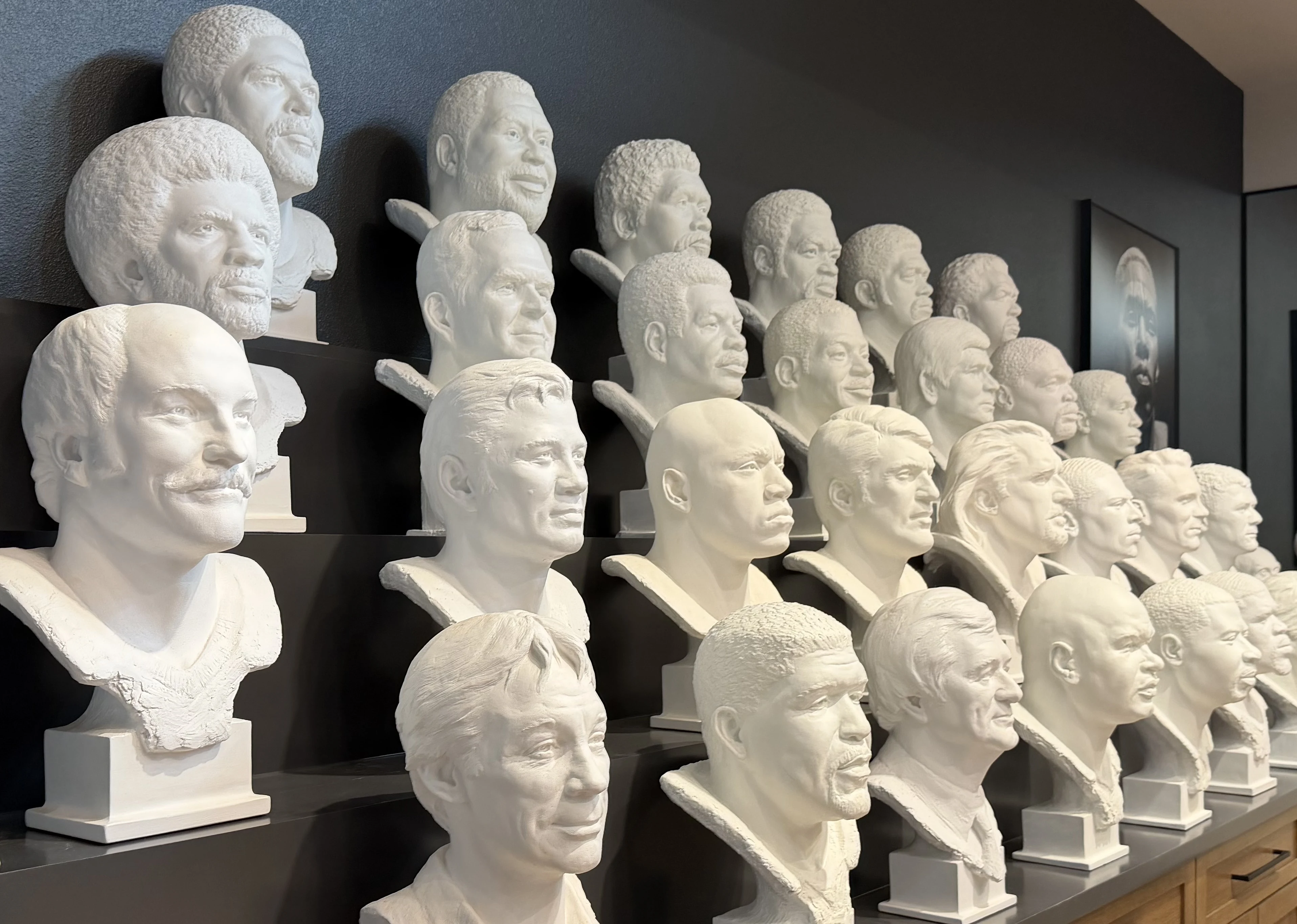 Wall of Scott Myers Pro Football Hall of Fame portrait busts