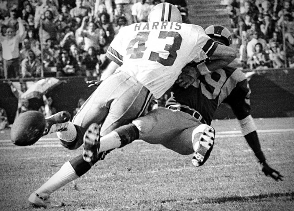 Cliff Harris making a tackle for the Dallas Cowboys